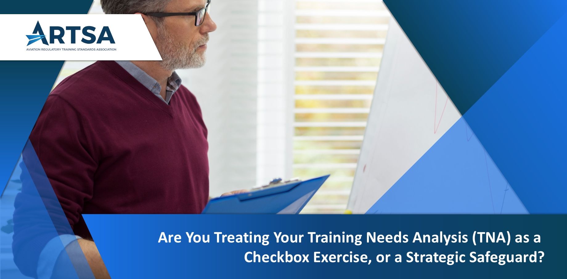 Man reviewing a table of training data, analyzing competencies and regulatory requirements.